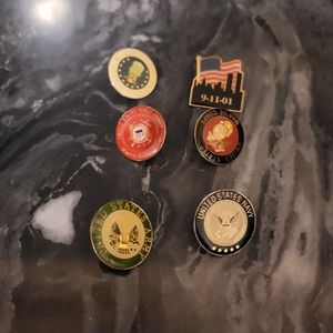Six pins from different branches of the US military